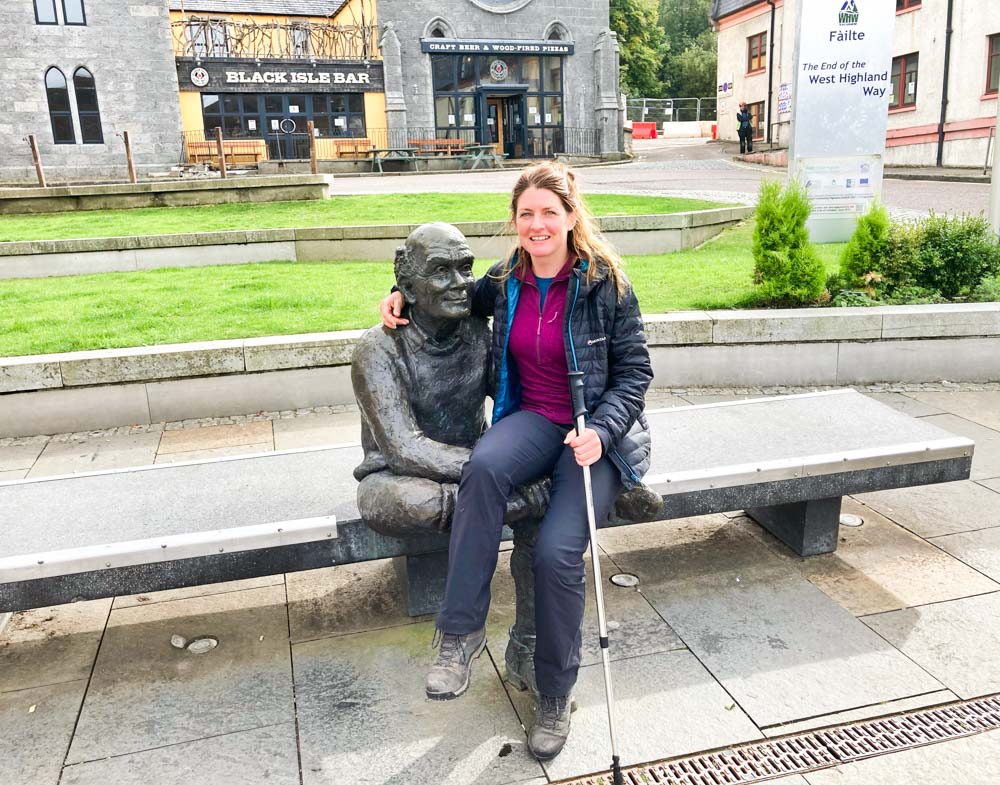 Man with sore feet statue at the end of the west highland way