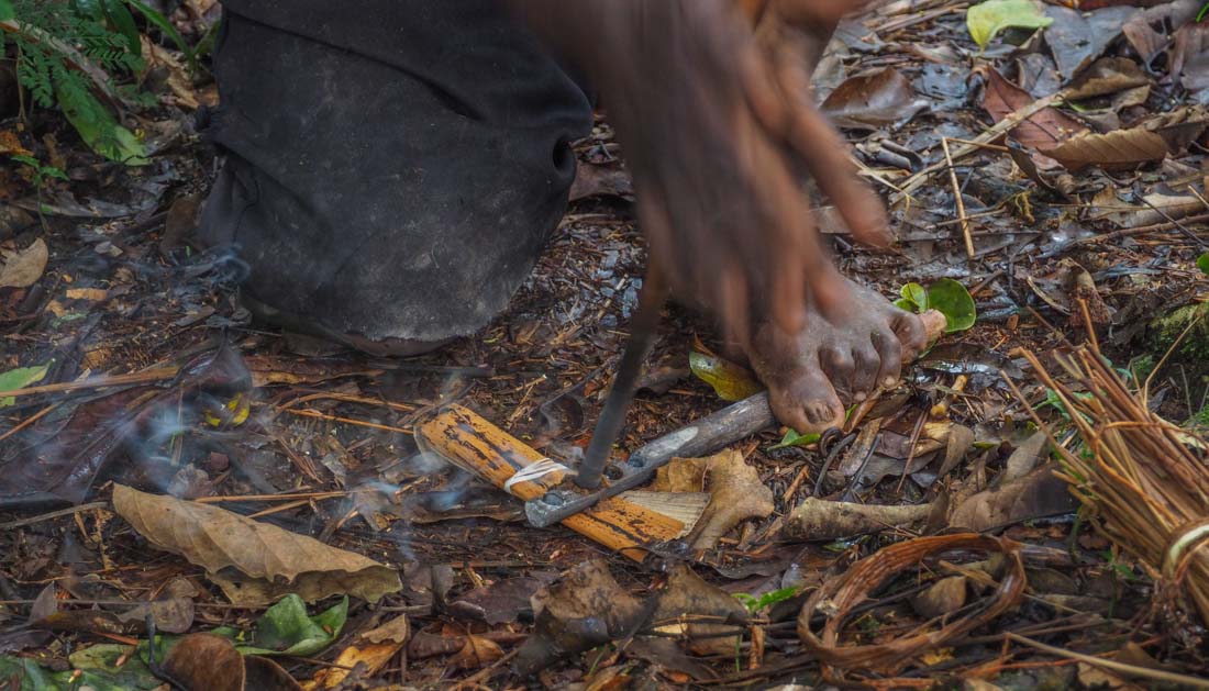 batwa making fire in forest