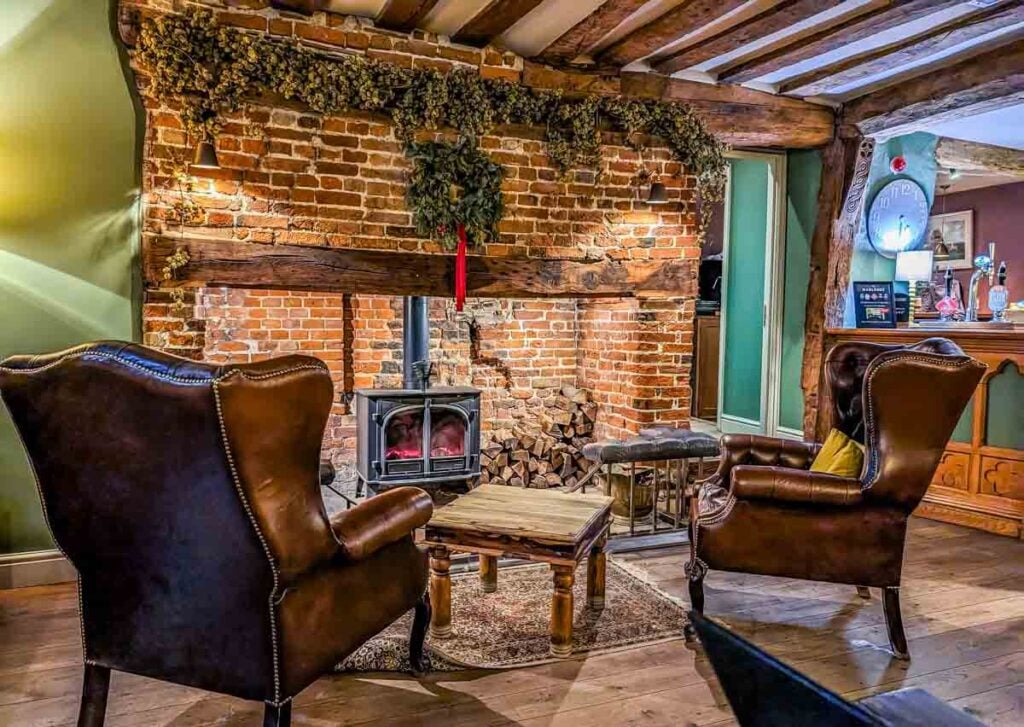 chairs and fireplace in the bar area