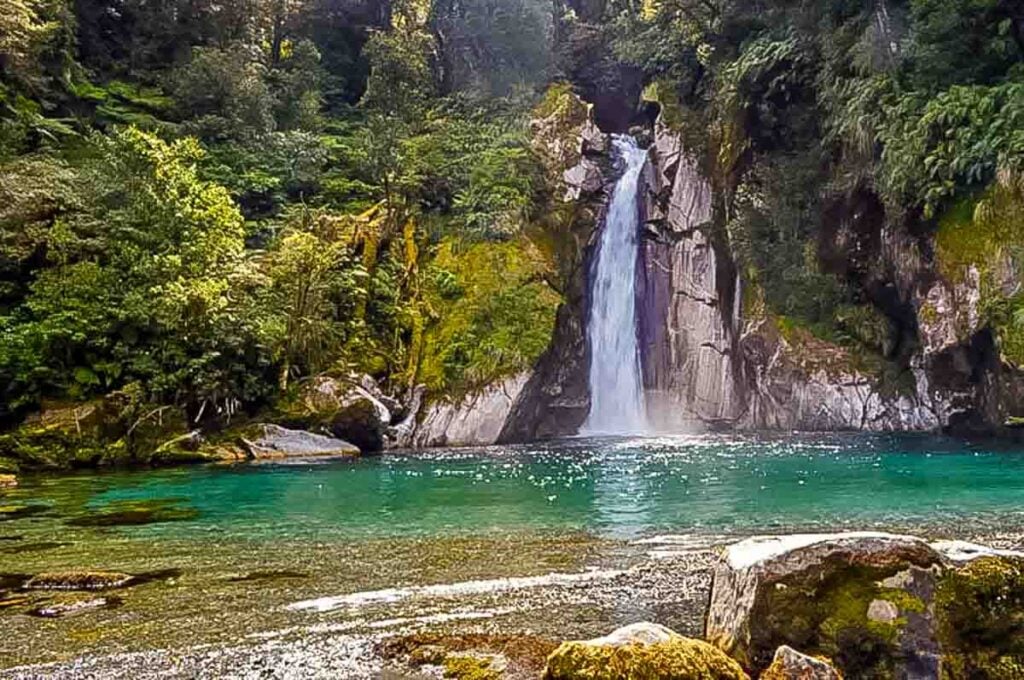 turquoise pool and waterfall