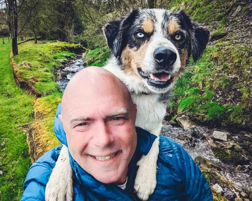 happy baldhiker and dog