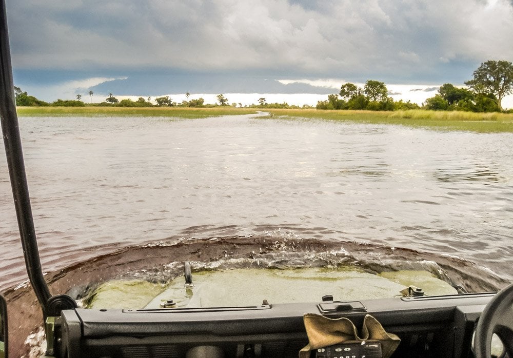 driving through flooded river africa