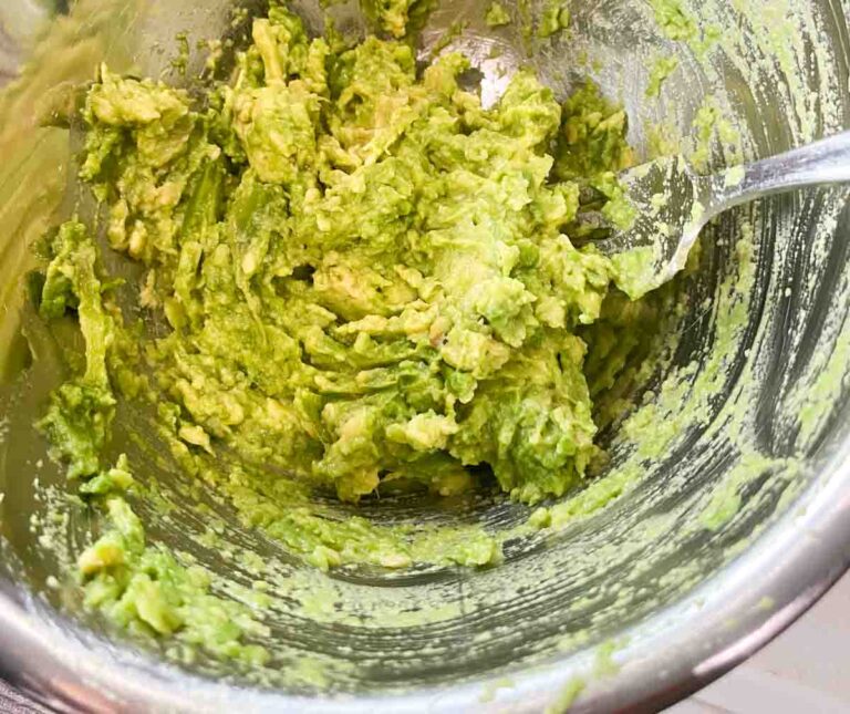 mashing avocado