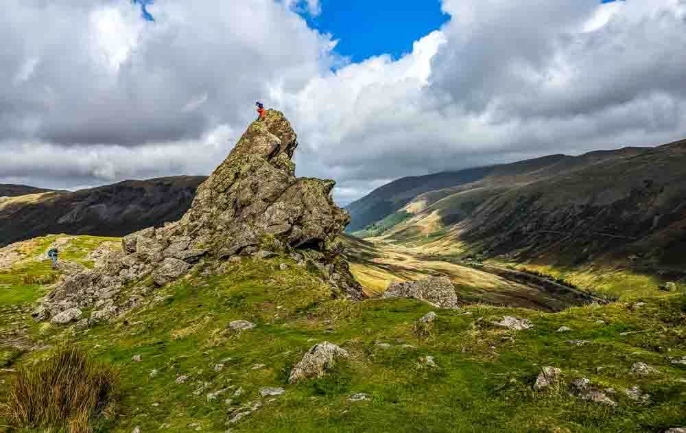 people scrambling on helm crag Howitzer