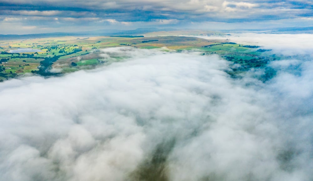 the foggy cloud below