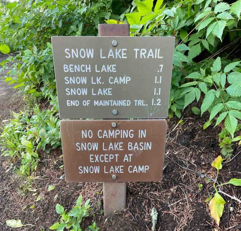 trail sign with distances